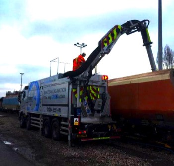  Force One Suction Excavator using power arm to extract ballast directly from on track rail trailer 